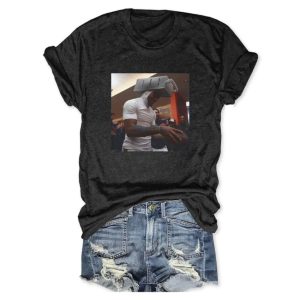 Black cotton t-shirt by Icestork featuring a viral graphic of Caleb Williams wearing a cheese grater on his head while holding a football.