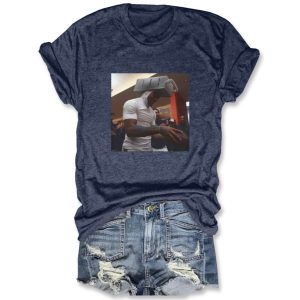Dark heather gray cotton t-shirt by Icestork featuring a viral graphic of Caleb Williams wearing a cheese grater on his head while holding a football.