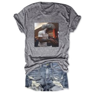 Heather gray cotton t-shirt by Icestork featuring a viral graphic of Caleb Williams wearing a cheese grater on his head while holding a football.